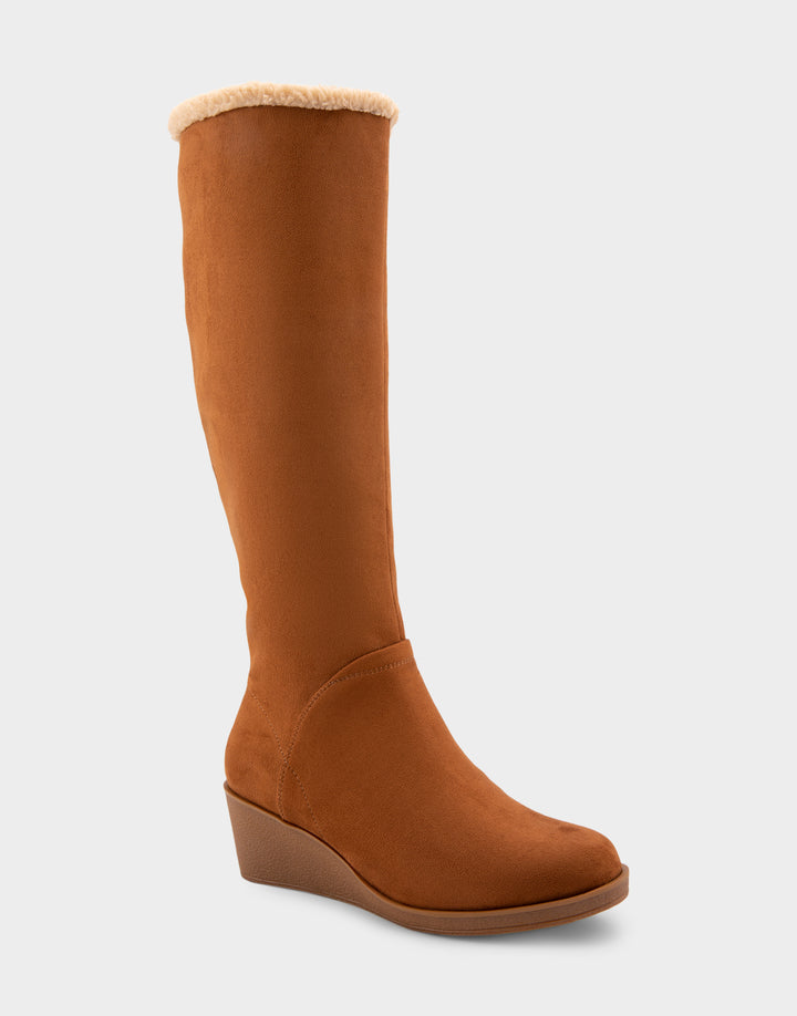 Comfortable Women's Faux Shearling Trimmed Knee High Wedge Boot in Tobacco Faux Suede Side Angle View