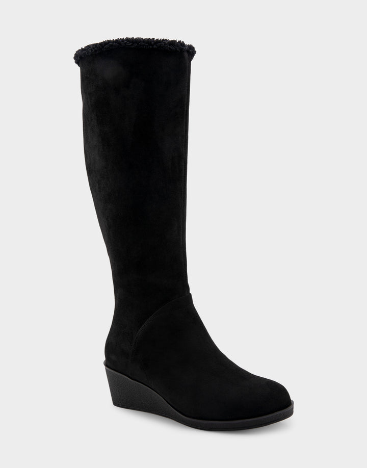 Comfortable Women's Faux Shearling Trimmed Knee High Wedge Boot in Black Faux Suede Side Angle View