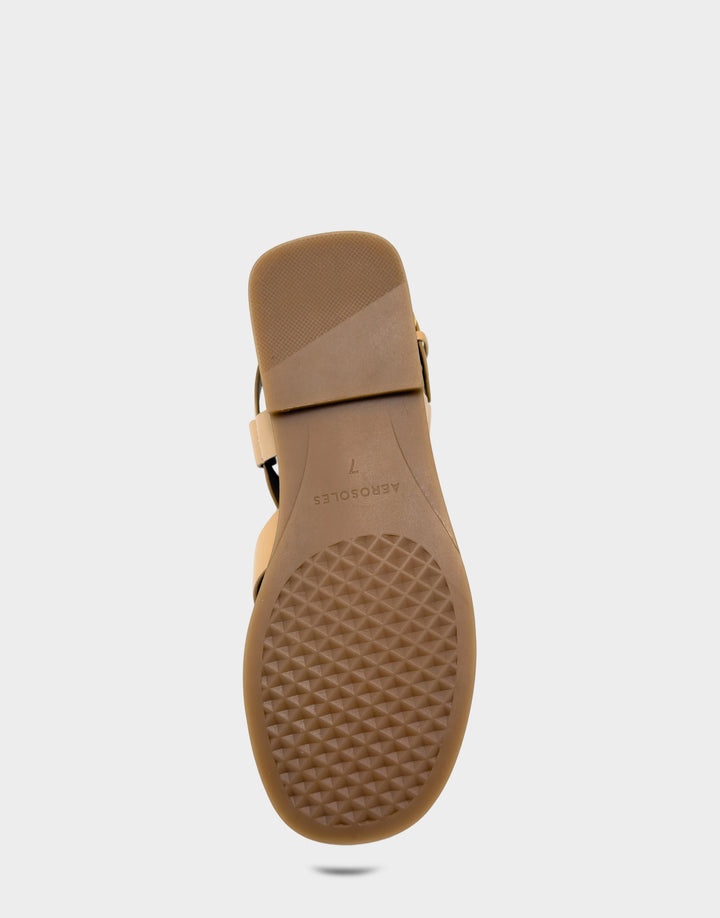 Comfortable Women's Flat Sandal in Natural Faux Leather Bottom View