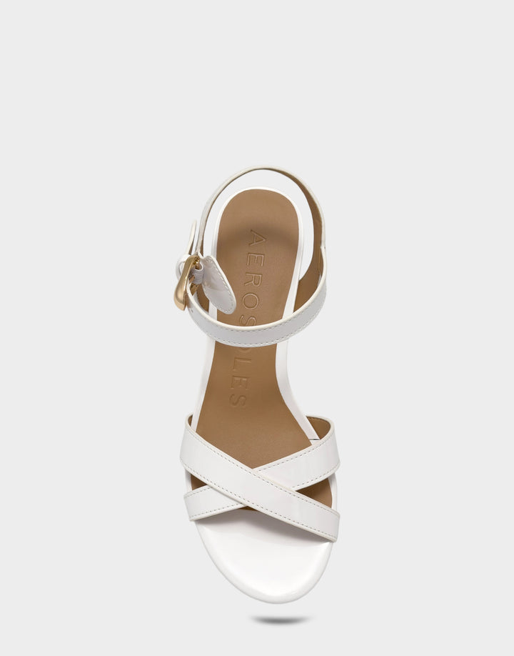 Comfortable Women's Low Heeled Sandal in White Faux Patent Full Front View