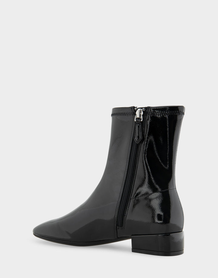 Comfortable Women's Nina Low Block Heel Bootie In Black Patent Faux Leather, back angle view