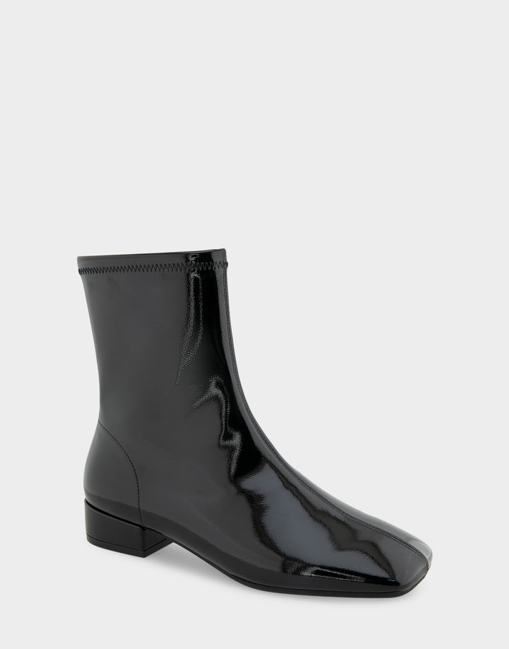 Comfortable Women's Nina Low Block Heel Bootie In Black Patent Faux Leather, angle view